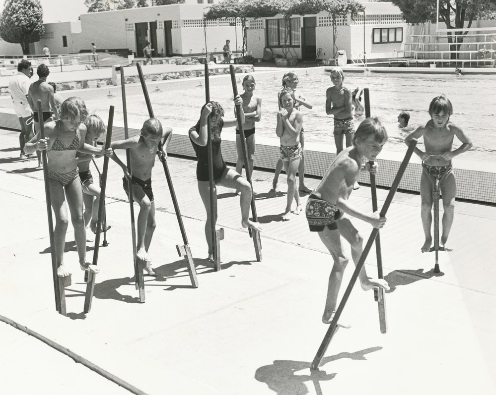 Stilt walking at the Elizabeth Swimming pool