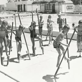Stilt walking at the Elizabeth Swimming pool