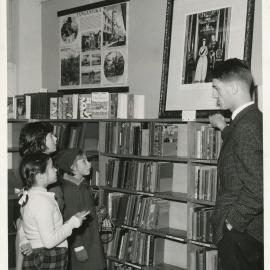 Elizabeth Librarian, Warwick Dunstan with portrait of Queen Elizabeth and Duke of Edinburgh, July 1963