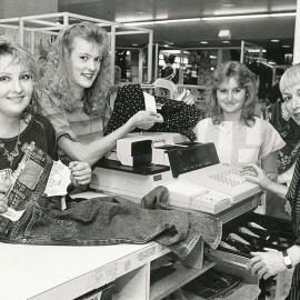 Showing the operation of the cash register at John Martin's Elizabeth
